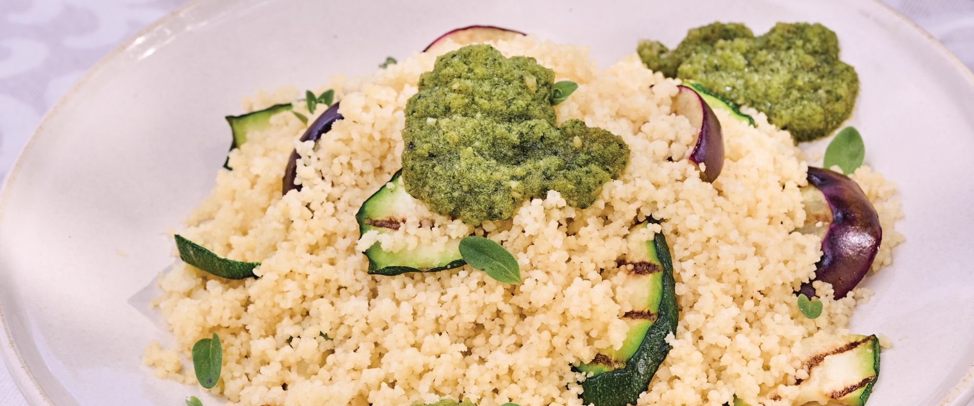 Couscous salad with pesto, eggplant and grilled zucchini
