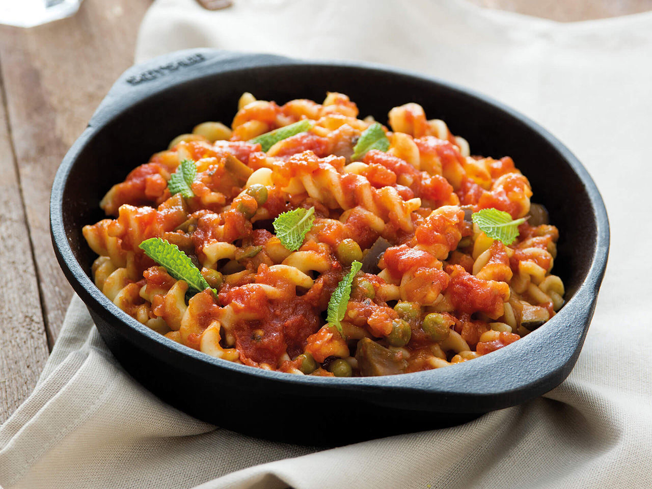 Fusilli with tomato sauce and peas