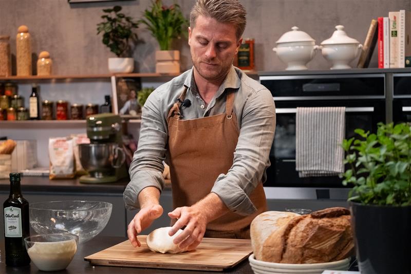 Fulvio prepares a loaf of bread