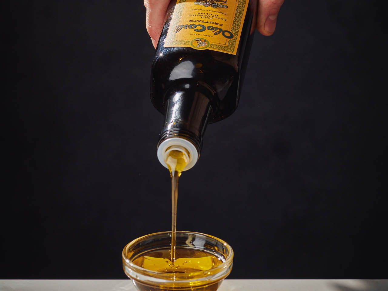 Olive oil poured into a bowl
