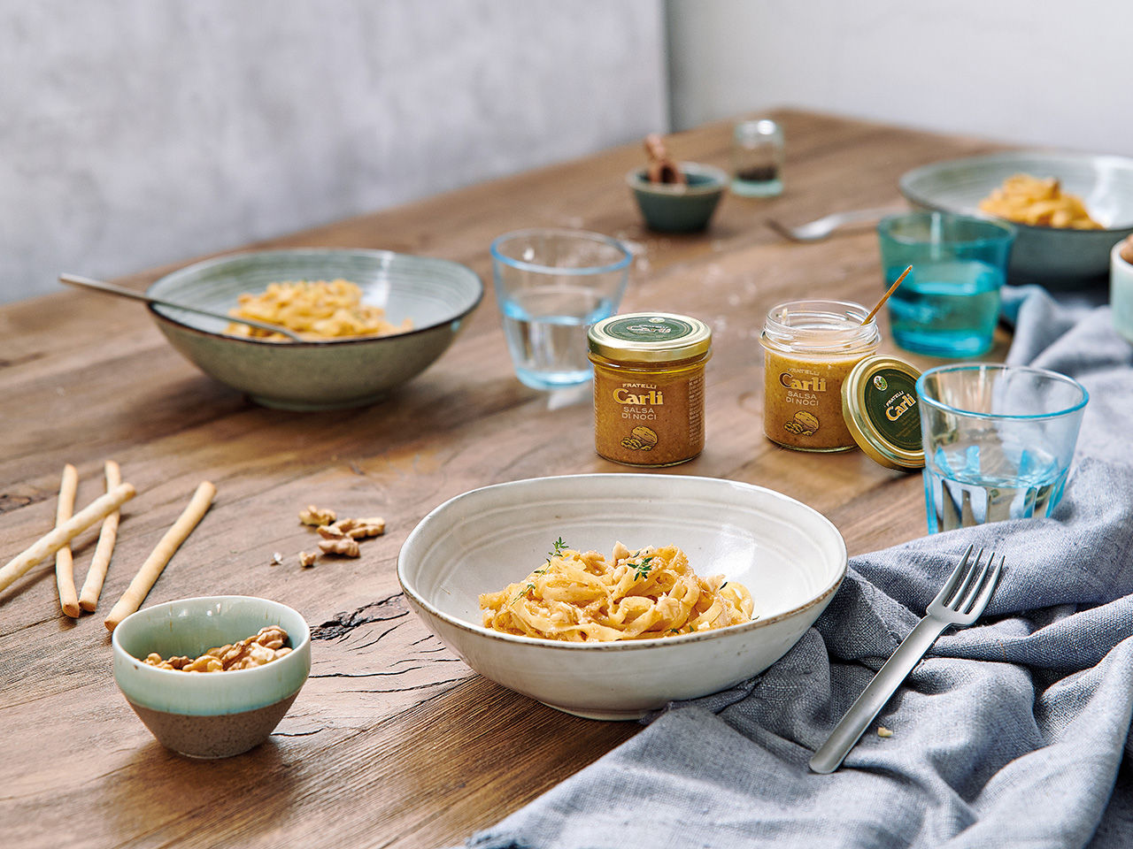 Plates of spaghetti with walnut sauce