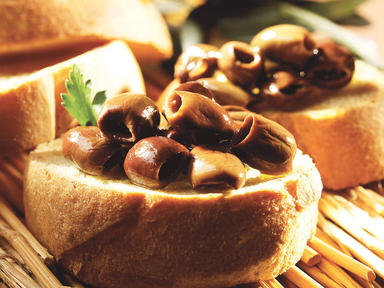 Slices of bread with pitted olives